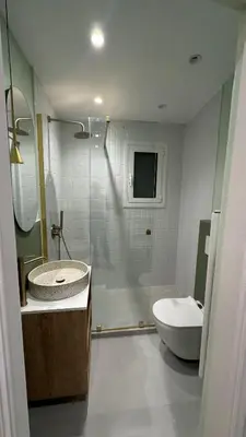 a bathroom with a shower and a sink and a toilet at Acropolis luxury home by Cleo in Athens