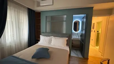 a bedroom with a bed with a hat on it at Acropolis luxury home by Cleo in Athens