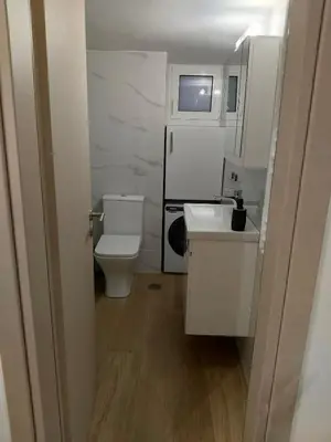 a small bathroom with a toilet and a sink at Cozy 1-Bedroom Flat in the Heart of Athens by ΜΡS in Athens