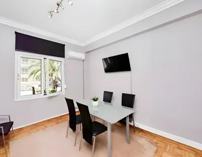 a dining room with a table and chairs at Panathenaic Athens Center Apartment in Athens