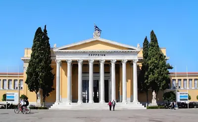 a large building with columns in front of it at Panathenaic Athens Center Apartment in Athens