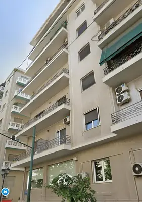 an apartment building with balconies and air conditioners at Panathenaic Athens Center Apartment in Athens