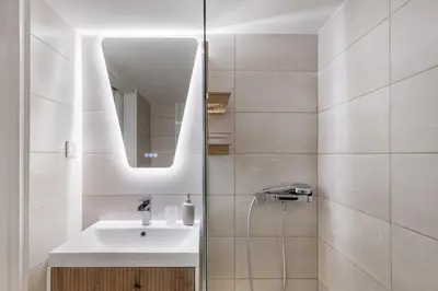 a bathroom with a sink and a mirror at Viora - Stunning Deluxe Studio in Athens in Athens