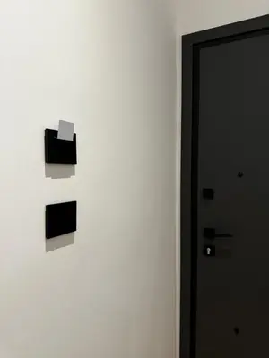 a wall with a piece of paper on it next to a door at Downtown Modern Studio in Athens