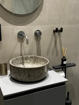 a bathroom with a large stone tub on a counter at Downtown Modern Studio in Athens