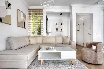 a living room with a couch and a chair at Whitewood Residence in Athens