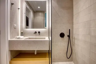 a bathroom with a sink and a mirror at Whitewood Residence in Athens