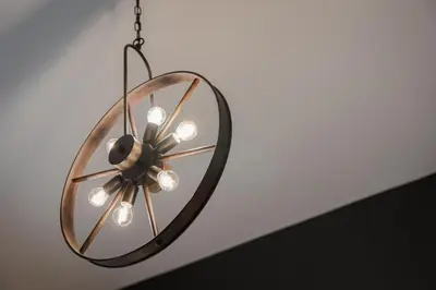 a chandelier with a mirror hanging from a ceiling at Acropolis Atmospheric Apartment in Athens