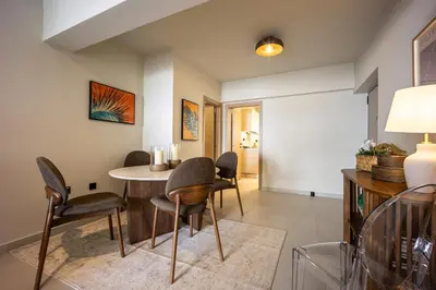 a dining room with a table and chairs at Marbella Living Pangrati By O&O Group in Athens