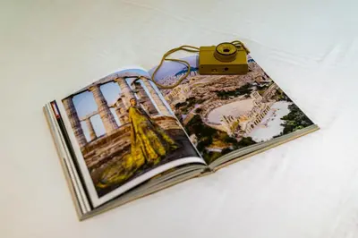a book with a camera on top of it at Marbella Living Pangrati By O&O Group in Athens