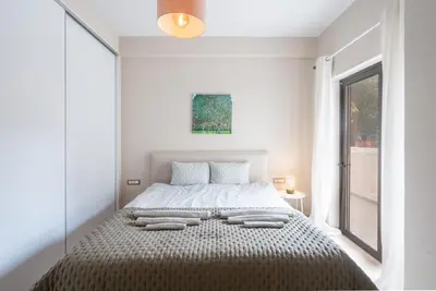 a bedroom with a bed with two pillows on it at The One With The Lemon Tree in Athens