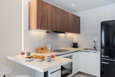 a kitchen with a counter with food and drinks on it at 2BD Luxury Sea View Penthouse in Astir Beach in Athens