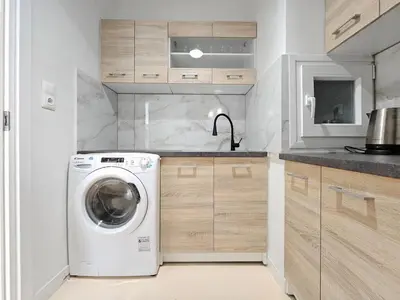 a kitchen with a washing machine and a sink at Casa Divas City Stay in Athens