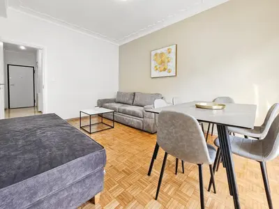 a living room with a bed and a table and chairs at Casa Divas City Stay in Athens