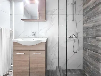 a bathroom with a sink and a shower at Casa Divas City Stay in Athens