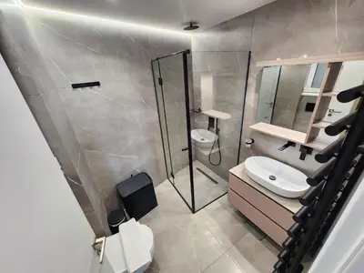 a bathroom with a shower and a toilet and a sink at Acropolis Vista View in Athens