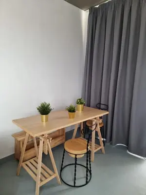 a wooden table with two potted plants on it at athens parthenon view in Athens