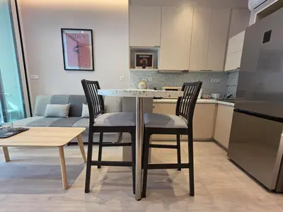 a kitchen with a table and two chairs in a kitchen at Syntagma Elegance on Ermou in Athens