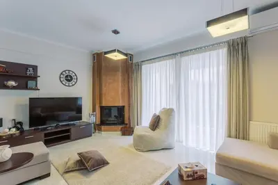 a living room with a couch and a tv at Cozy 2 Bedroom Apartment Gaia by Philoxenia in Athens
