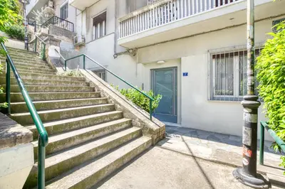 a set of stairs in front of a building at Acropolis Vintage Apartment in Athens