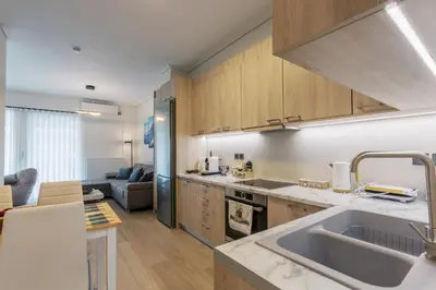 a kitchen with a sink and a counter top at Bright 2 Bedroom Apartment Helios by Philoxenia in Athens