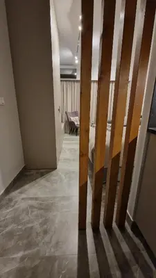 a hallway with a bed in a room at Athens Central Studios 2 in Athens