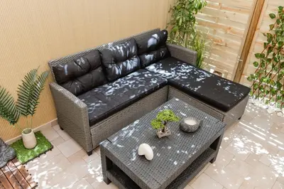 a living room with a leather couch and a table at Luxury&Zen DownTown Apartment by MPS in Athens