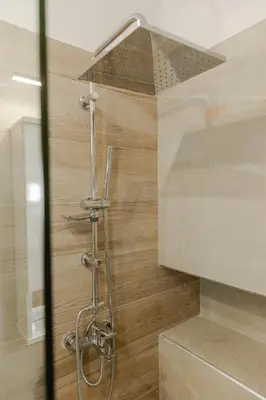 a shower with a shower head in a bathroom at Luxury&Zen DownTown Apartment by MPS in Athens