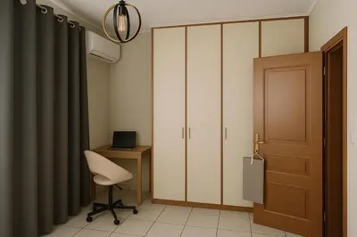 a room with a desk and a chair and a closet at Apartment for 4 with Acropolis view - Athens 5km Piraeus 5km Metro 5' walk in Piraeus