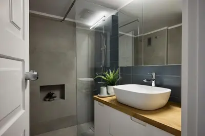 a bathroom with a white sink and a shower at Acropolis Delight Residence II in Athens