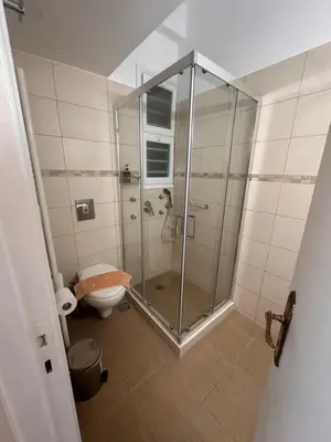 a bathroom with a shower and a toilet at Check Point - Acropolis Shadow in Athens