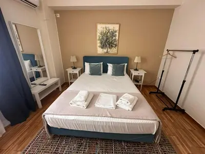 a bedroom with a large bed with two pillows on it at Check Point - Acropolis Shadow in Athens