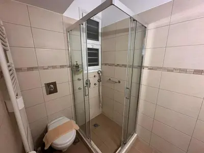 a bathroom with a shower and a toilet at Check Point - Acropolis Shadow in Athens