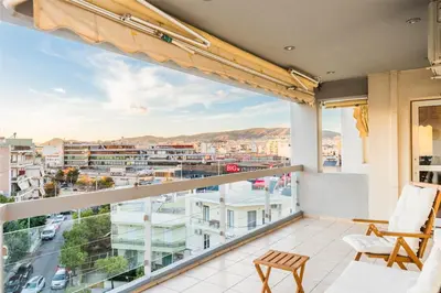 a balcony with a view of a city at Cozy appartment in Neo Faliro, Piraeus in Piraeus