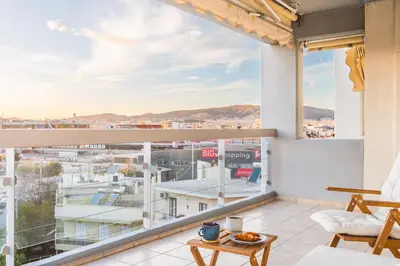 a balcony with a view of a city at Cozy appartment in Neo Faliro, Piraeus in Piraeus