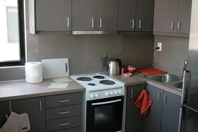 a small kitchen with a stove and a sink at SunLoft35 by MPS in Athens