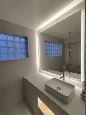 a bathroom with a sink and a mirror at SunLoft35 by MPS in Athens