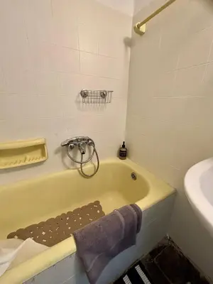 a bathroom with a bath tub and a sink at At Polyla Everything close,nothing loud in Athens