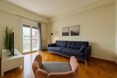 a living room with a couch and a chair at At Polyla Everything close,nothing loud in Athens