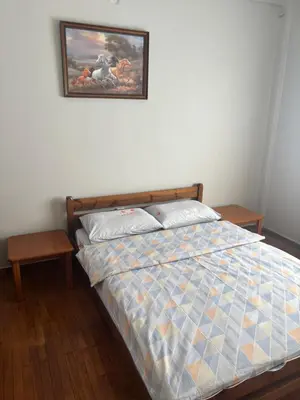 a bedroom with a bed and a picture on the wall at Onix 1 in Athens