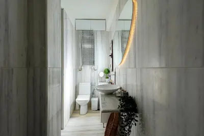 a bathroom with a sink and a toilet and a mirror at mylo akropoli views in Athens