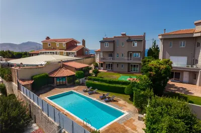 an aerial view of a house with a swimming pool at Blue Horizon Villa in Kalívia Thorikoú