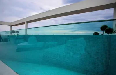 a swimming pool with a view of the ocean at The ROSE Luxury Penthouse with Private Swimming Pool in Athens
