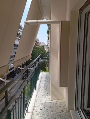 a balcony of a building with a view at Tataoulon 22, Nea Smirni in Athens