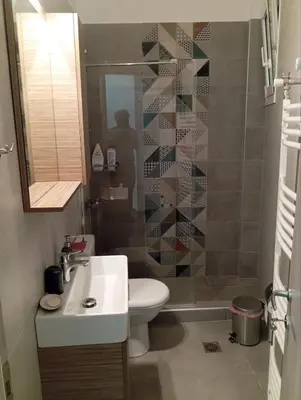 a bathroom with a sink and a toilet and a shower at Tataoulon 22, Nea Smirni in Athens