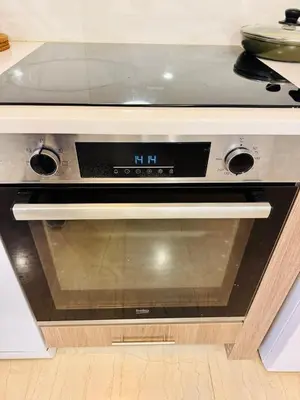 a oven with a clock on it in a kitchen at \u96c5\u5178\u5357\u90e8\u6d77\u6ee82km\u7684\u8212\u9002\u5bbd\u655e\u516c\u5bd3 in Athens
