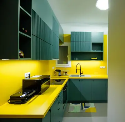 a kitchen with green and yellow cabinets and a sink at Urban comfort in Athens centre in Athens