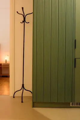 a room with a green sliding glass door at Urban comfort in Athens centre in Athens