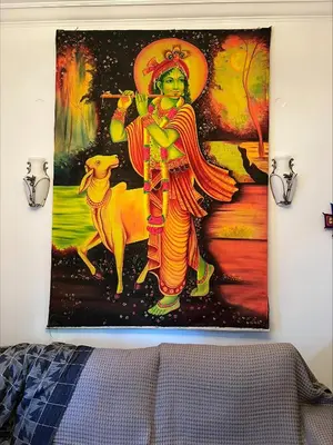 a tapestry hanging on a wall in a bedroom at Bohemian Athens home in Athens