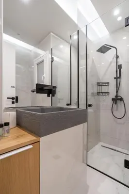 a bathroom with a tub and a sink and a shower at Ilisia Urban Elegance in Athens